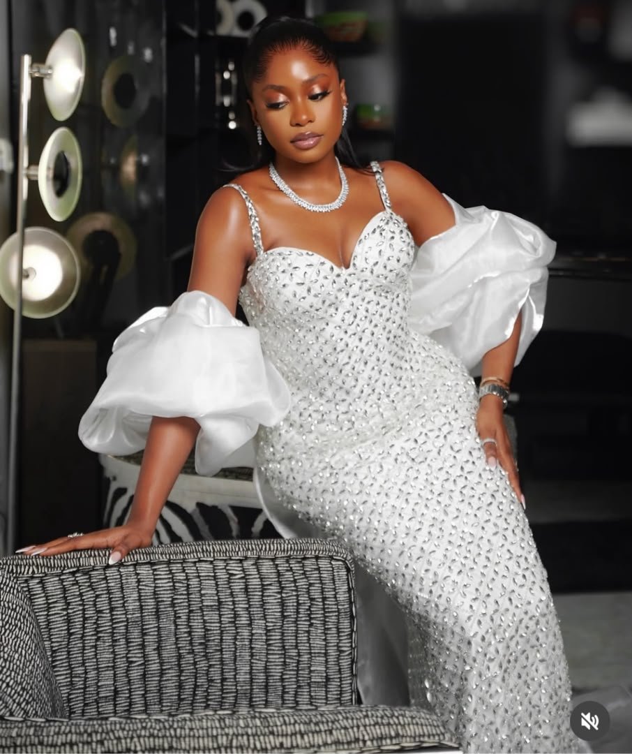 Chic white Asoebi gown with delicate embellishments