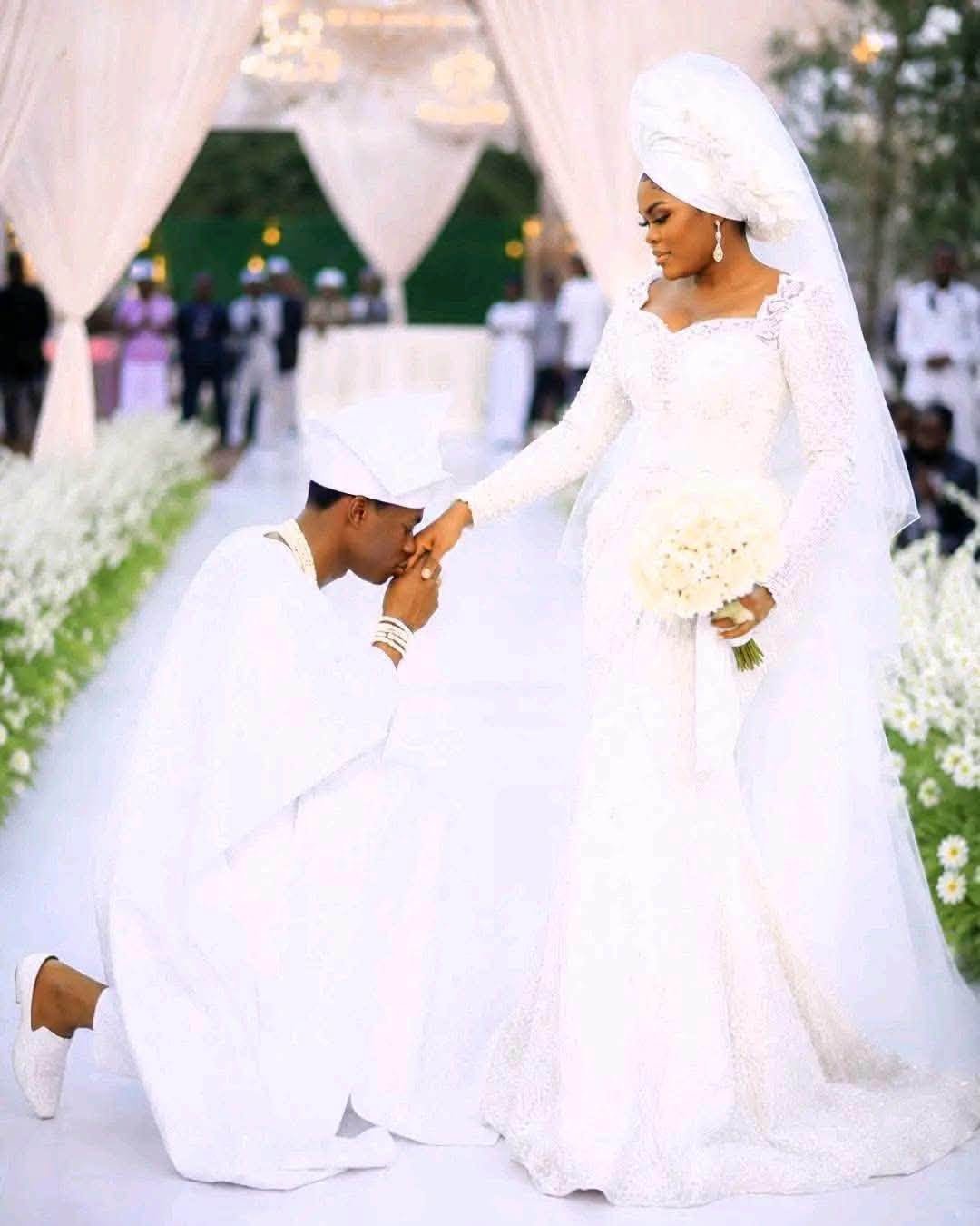 Elegantly tailored white wedding Asoebi outfit